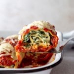 a lasagna roll being served from a pan