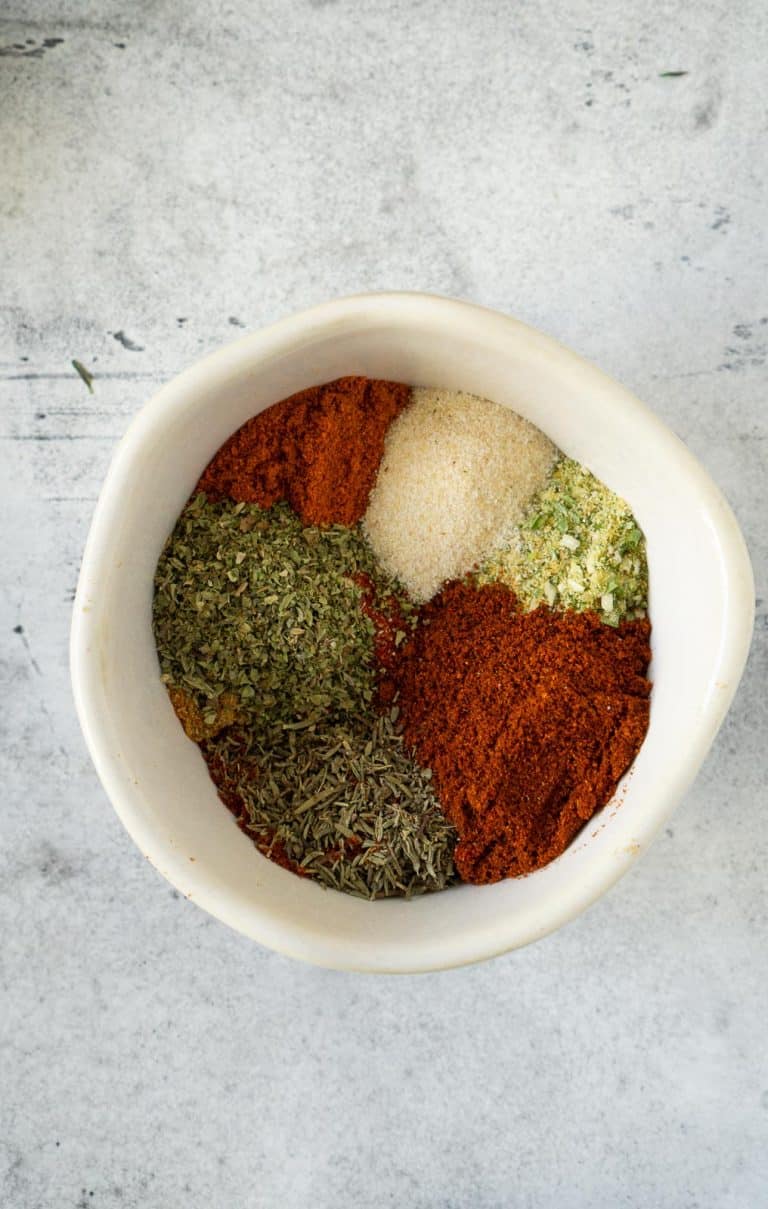 blackening seasoning in a small white bowl