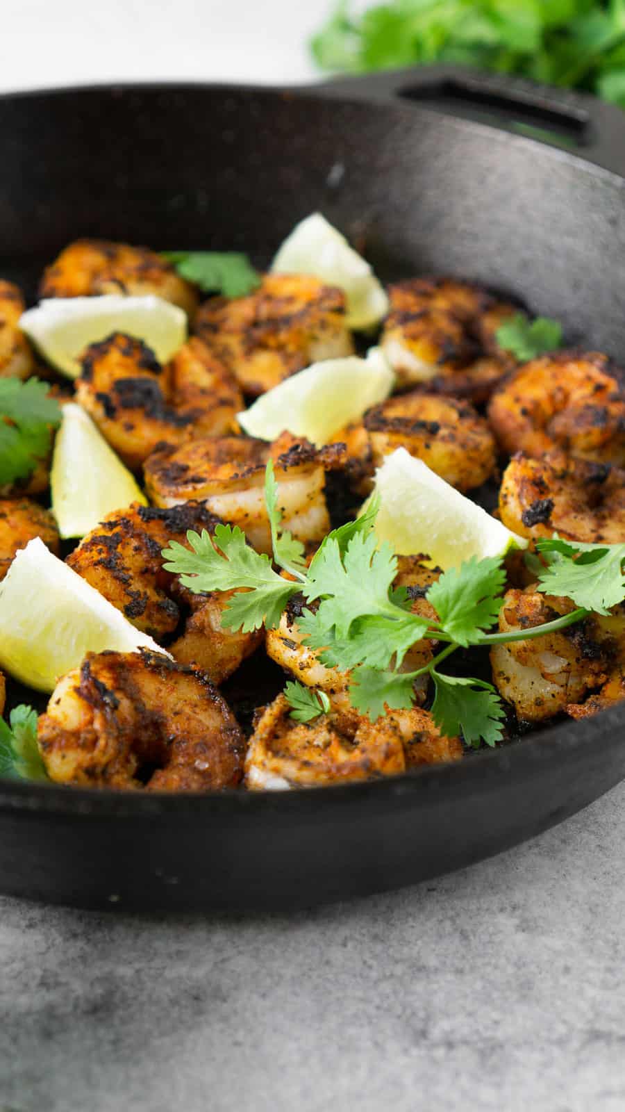 blackened shrimp in a cast iron pan