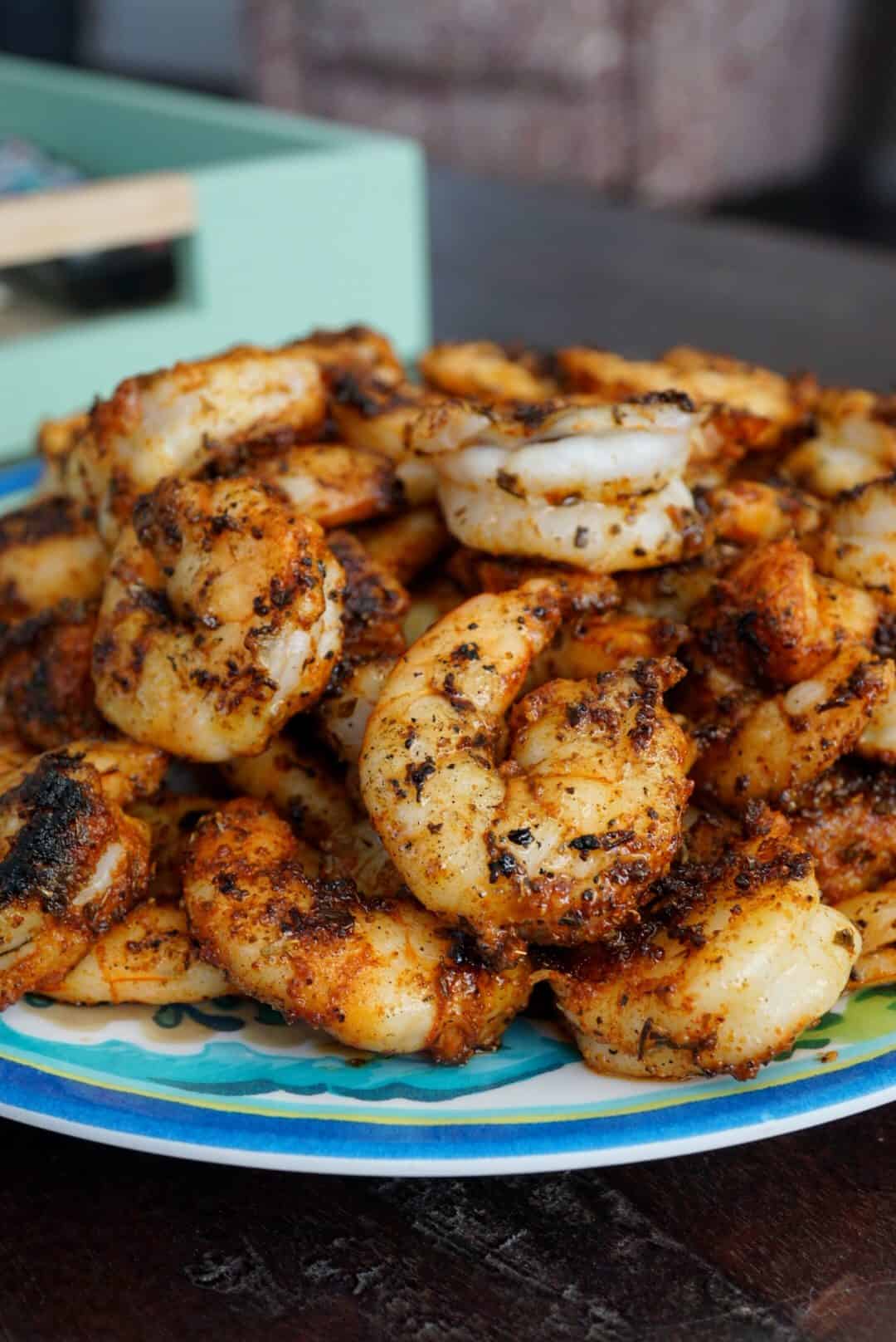 Blackened shrimp on a blue plate