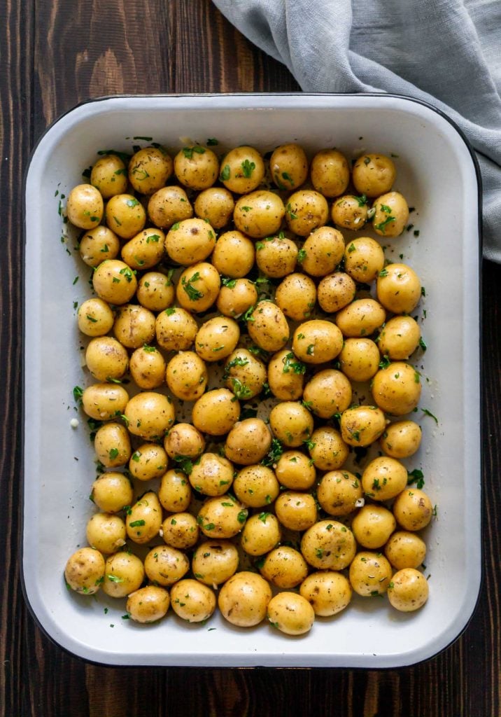 mini potatoes in a white baking dish 