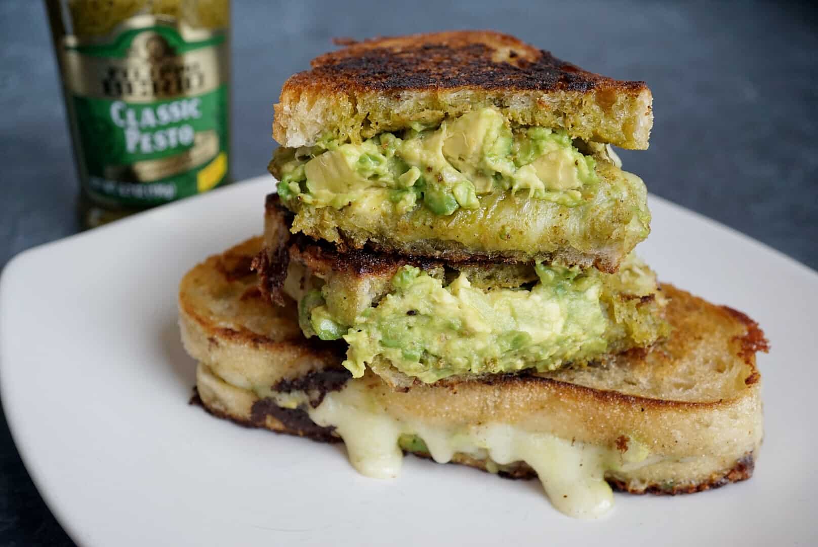 This Pesto Grilled Cheese is made with Filippo Berio Classic Pesto and stuffed with fresh avocado. It's a quick and easy weeknight dinner and sure to be a new favorite in your home.