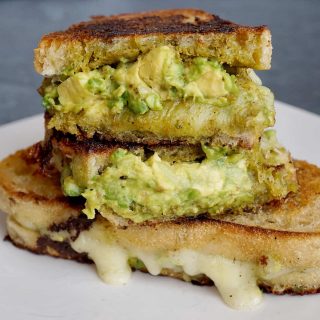 Pesto grilled cheese cut in half and stacked