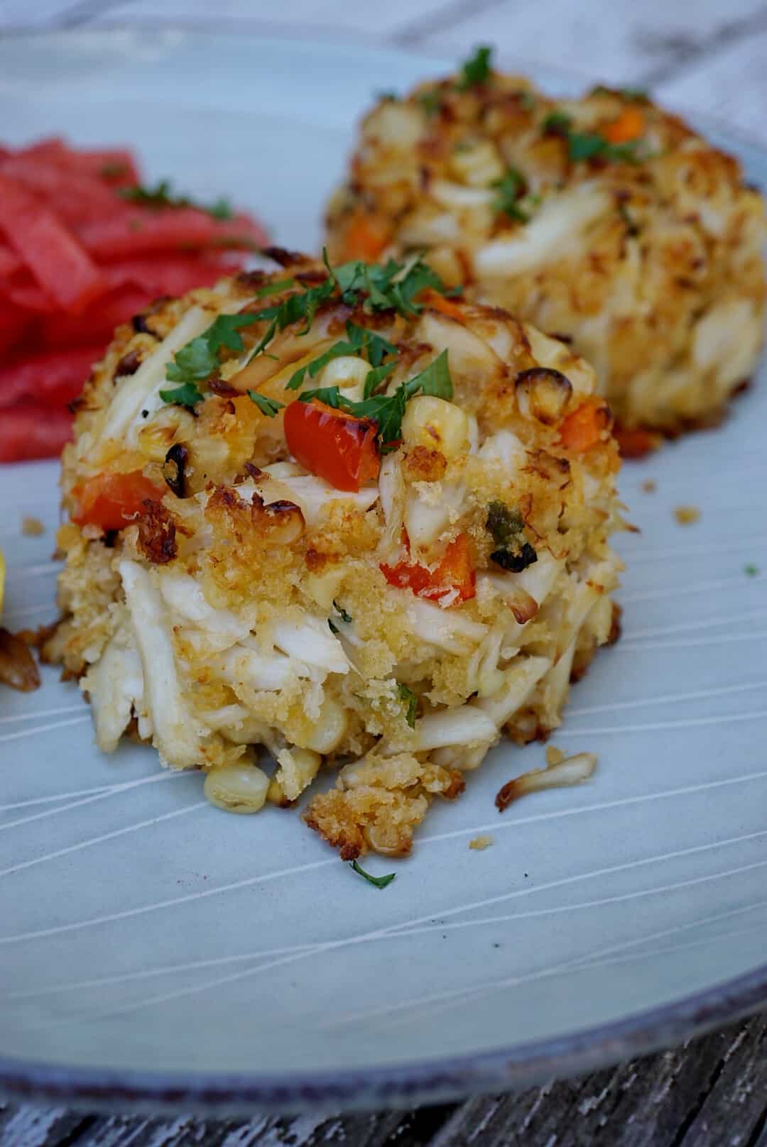 A Charred Crab Cake recipe that will be served at the Soul Food Sessions event July 29th. Soul Food Sessions hosts non-profit pop-up dinners to increase diversity throughout the food industry.