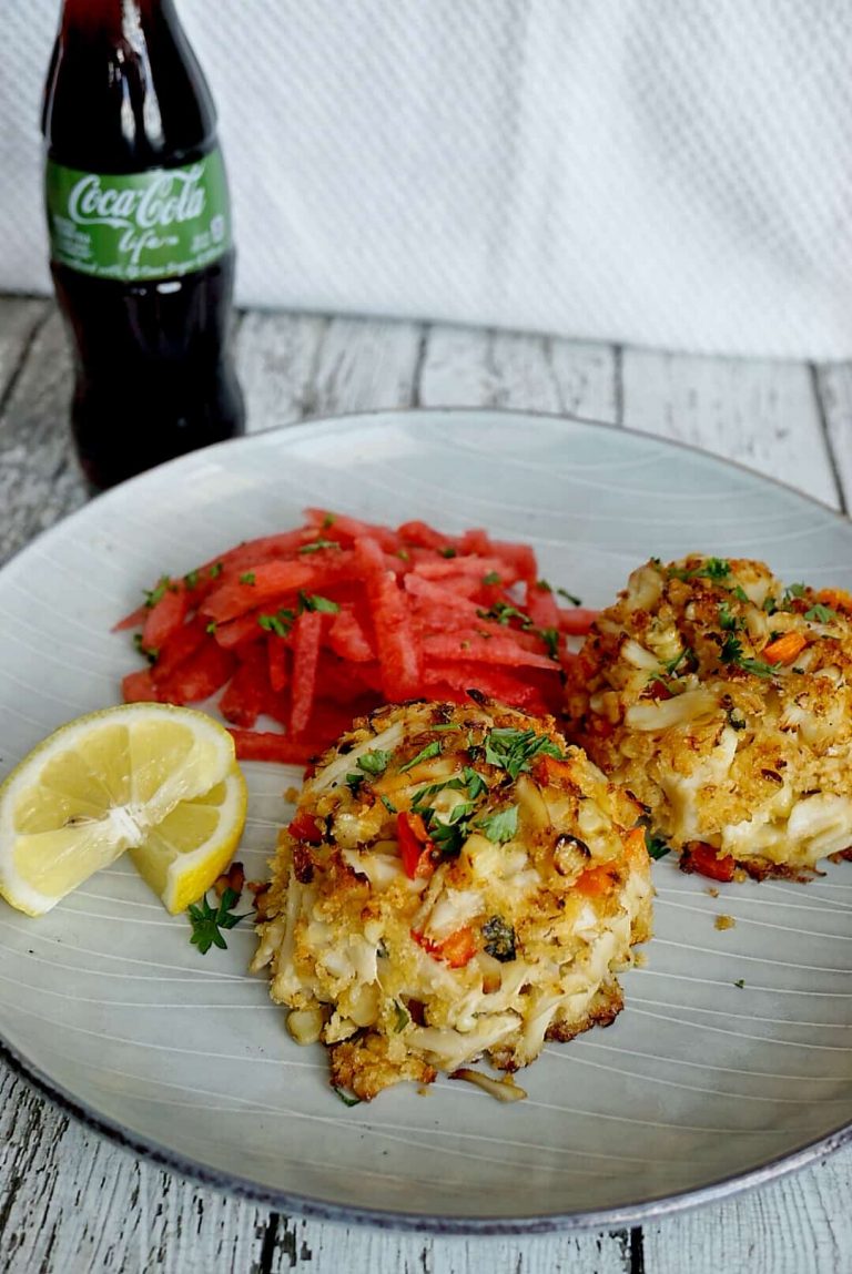 Crab caked on a plate with watermelon