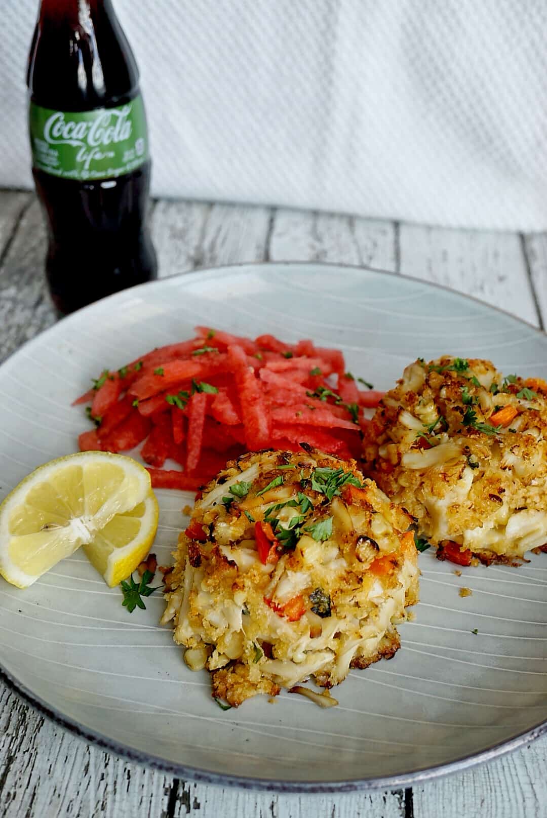 A Charred Crab Cake recipe that will be served at the Soul Food Sessions event July 29th. Soul Food Sessions hosts non-profit pop-up dinners to increase diversity throughout the food industry.