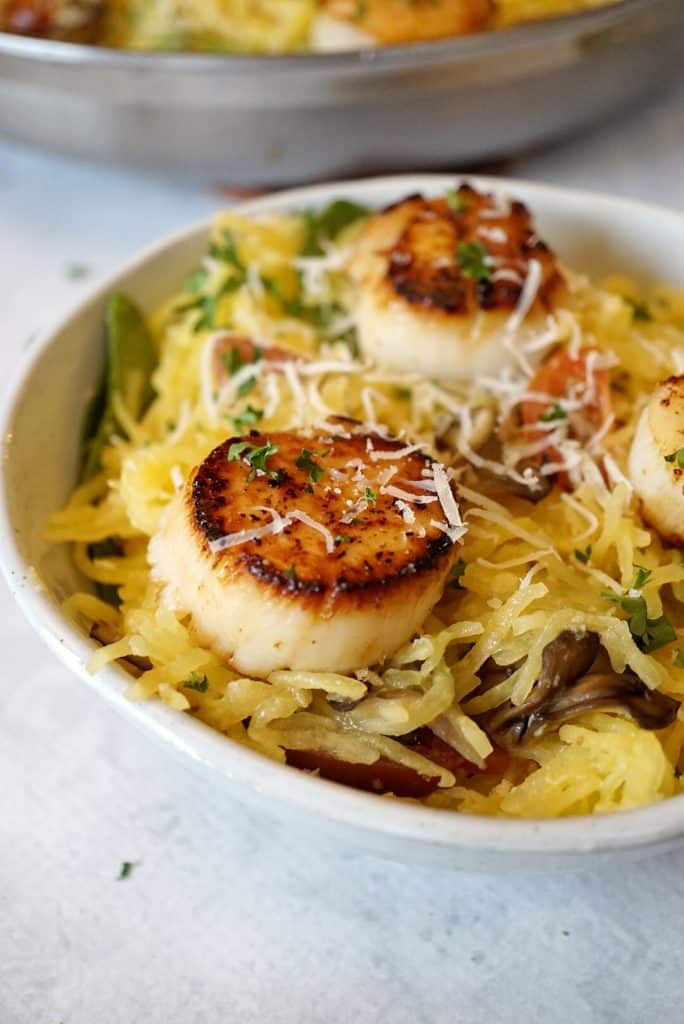 Close up of seared scallops and spaghetti squash