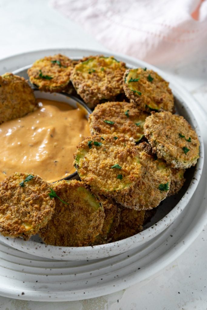 zucchini chips in a bowl with spicy mayo