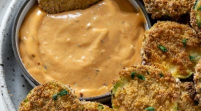 air fryer zucchini chip dipped in spicy mayo