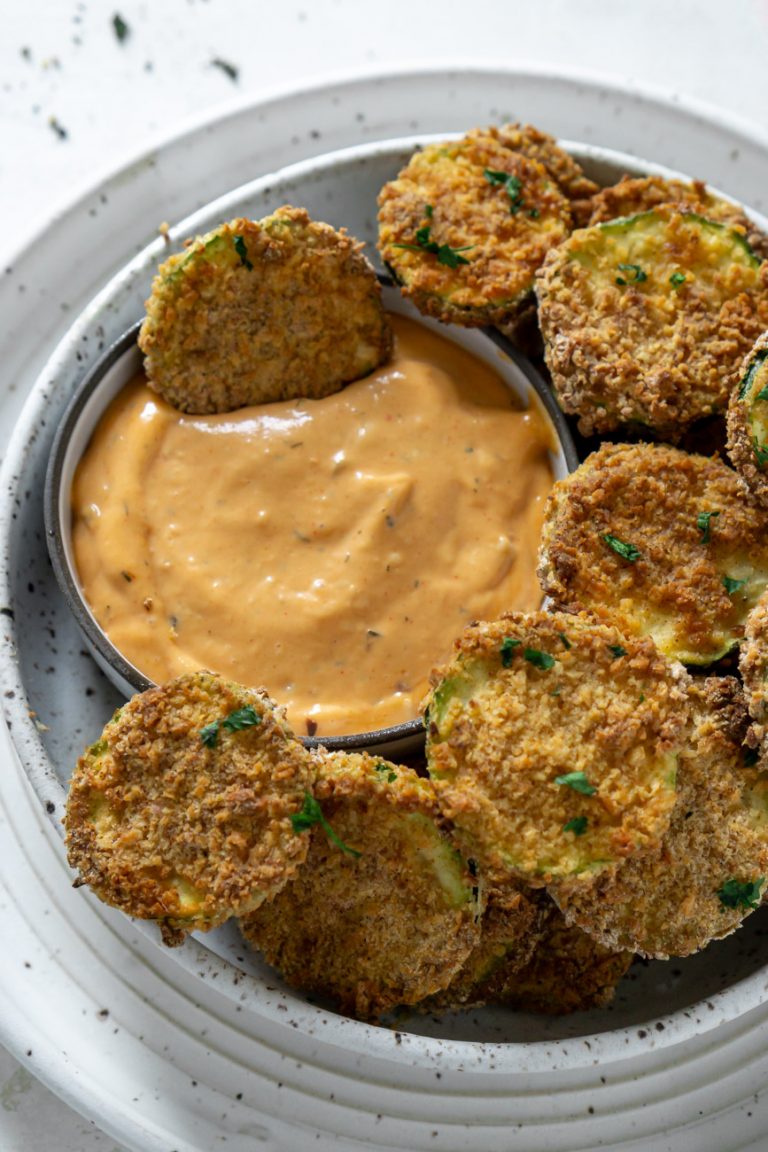 air fryer zucchini chip dipped in spicy mayo