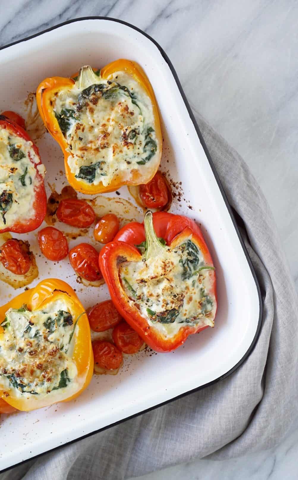 Vegetarian stuffed peppers in a white pan