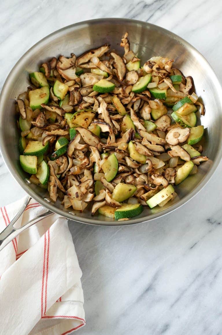zucchini and mushrooms in a skiillet