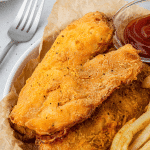 air fryer beer battered fish with fries and ketchup