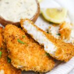 crispy air fryer fish on a white plate