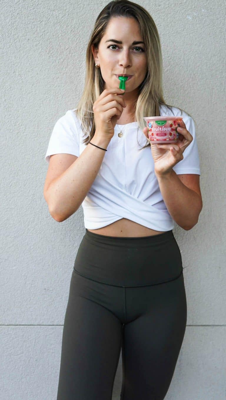 girl eating a kraft smoothie bowl for post-workout snack