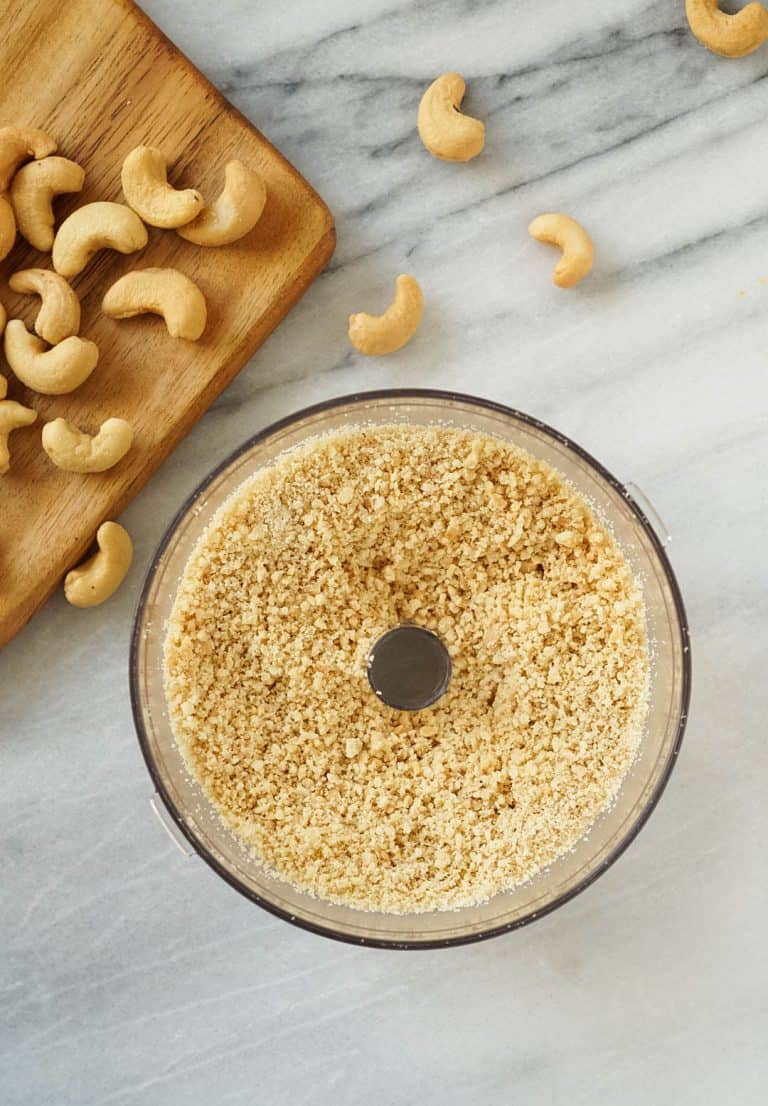 crumbled cashews in a food processor for vegan ricotta cheese