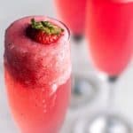 rossini cocktail in a glass with a strawberry