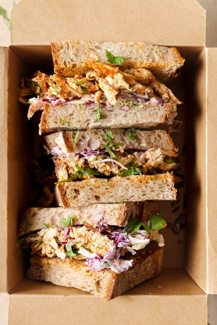 3 shredded chicken sandwiches in a paper box