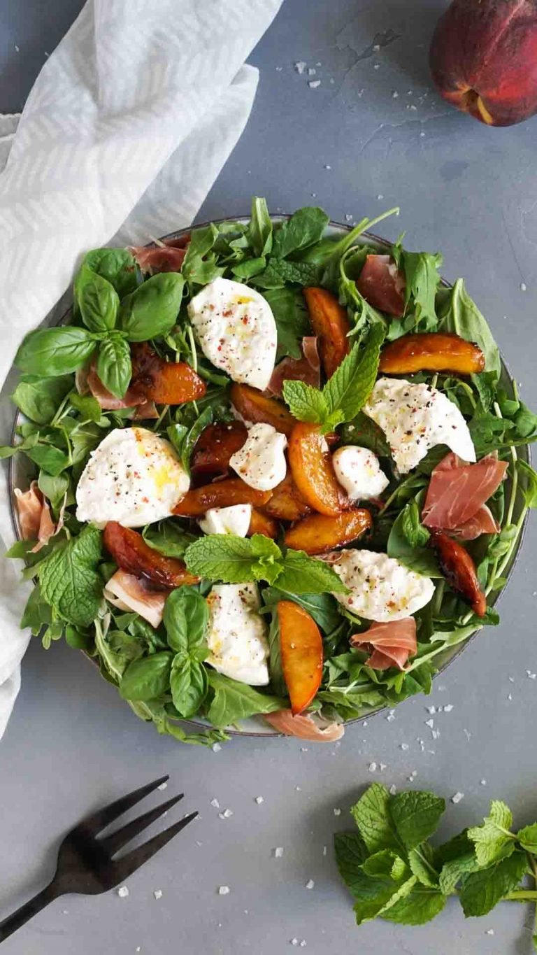 burrata salad on a large plate with a white napkin