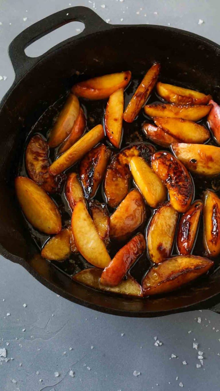 Caramelized peaches in a cast iron pan