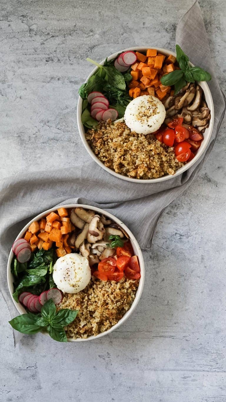 two quinoa breakfast bowls and a grey napkin