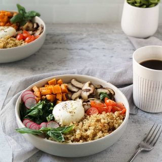 two quinoa breakfast bowls with a cup of coffee