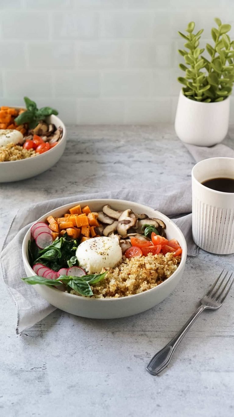two quinoa breakfast bowls with a cup of coffee