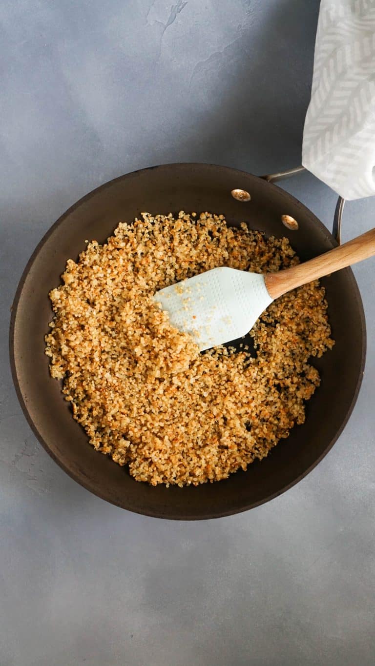 crispy quinoa in a pan with a spatula