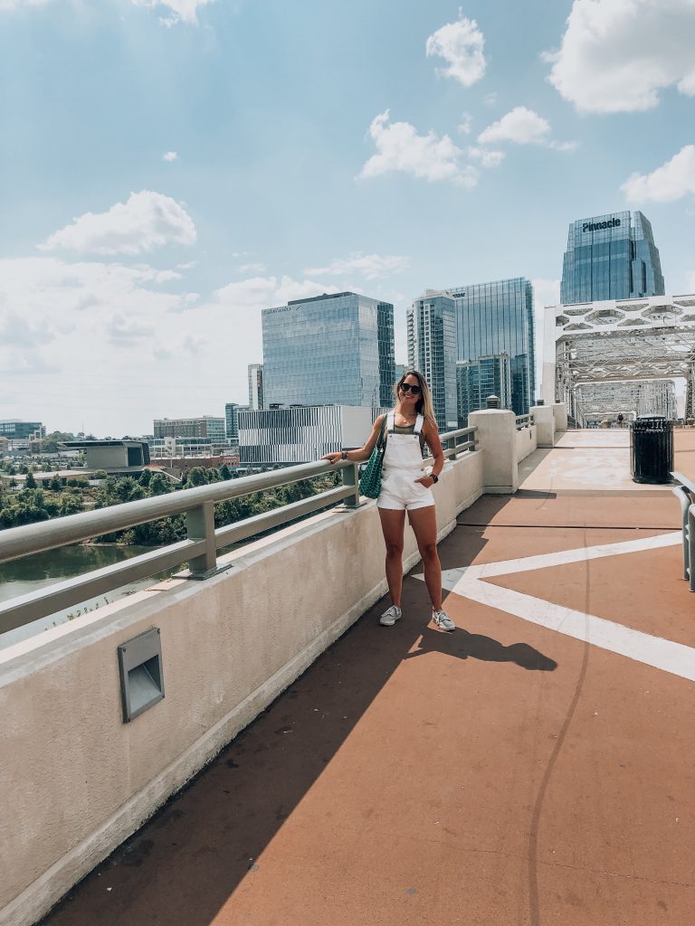 girl standing on the pedestrian bridge in nashville