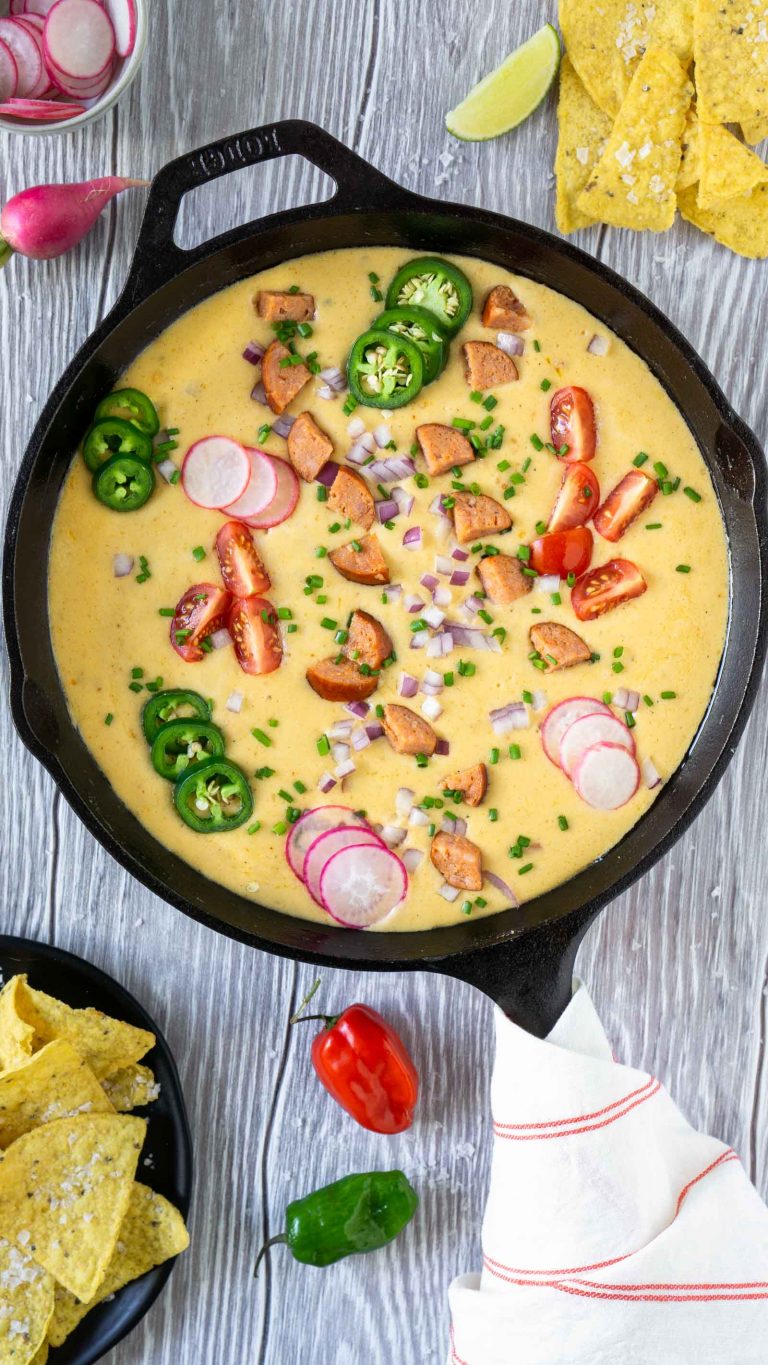 overhead shot of beer cheese dip in a cast iron