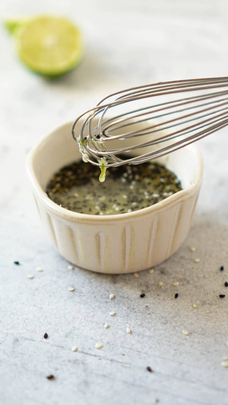 sesame ginger marinade in a small bowl with a whisk