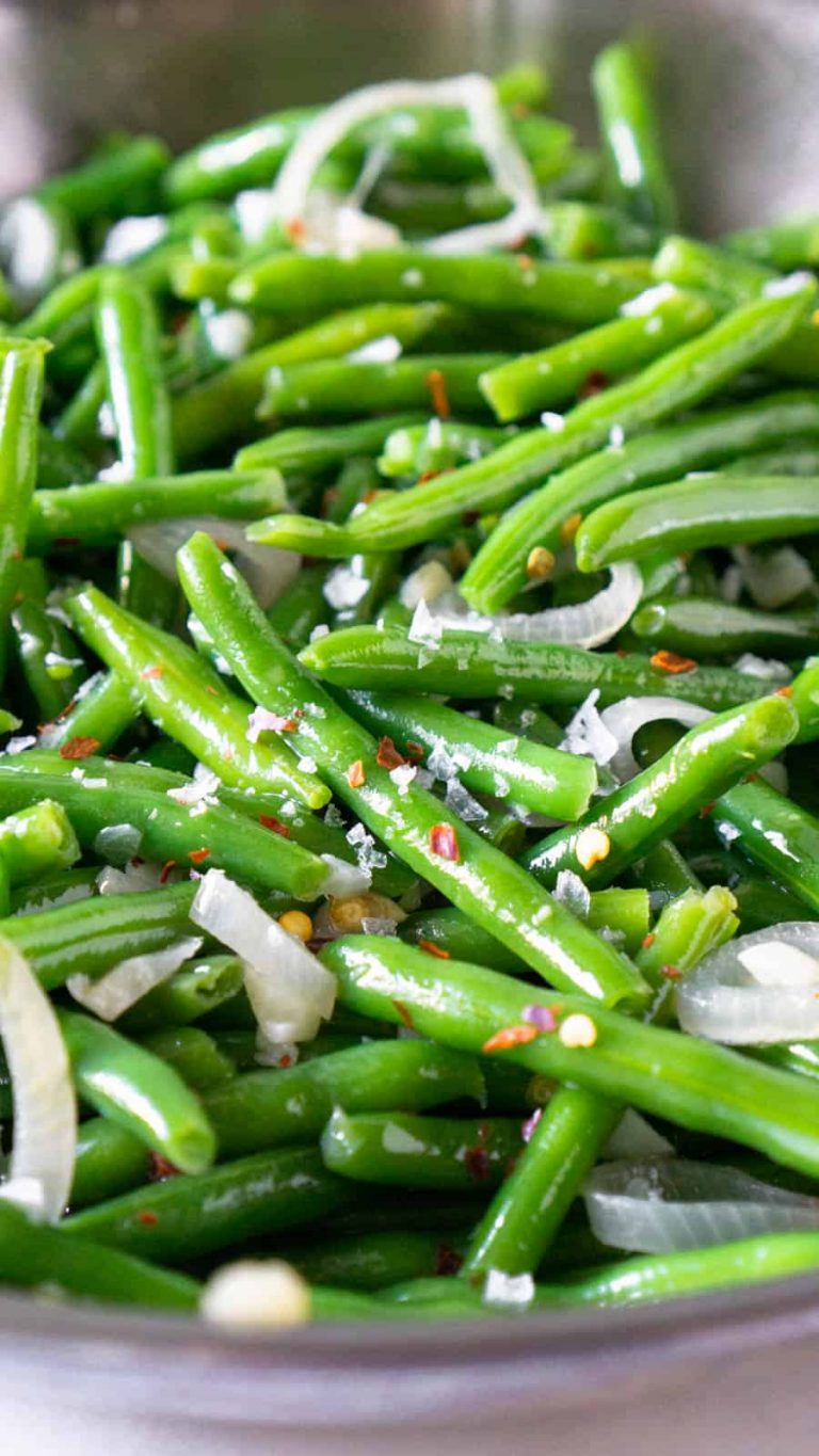 Sautéed green beans in a pan.