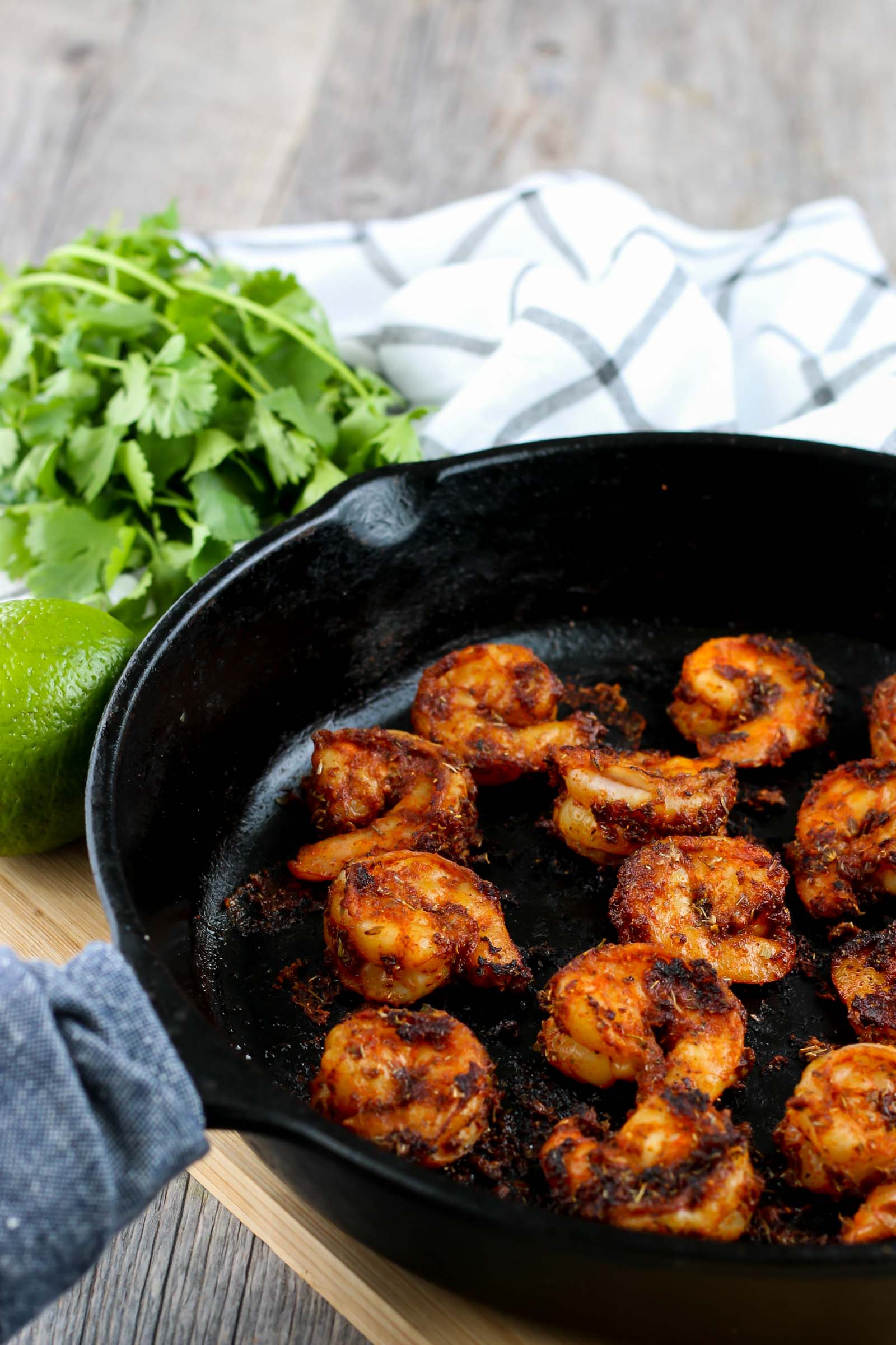 blackened shrimp in a black cast iron skillet