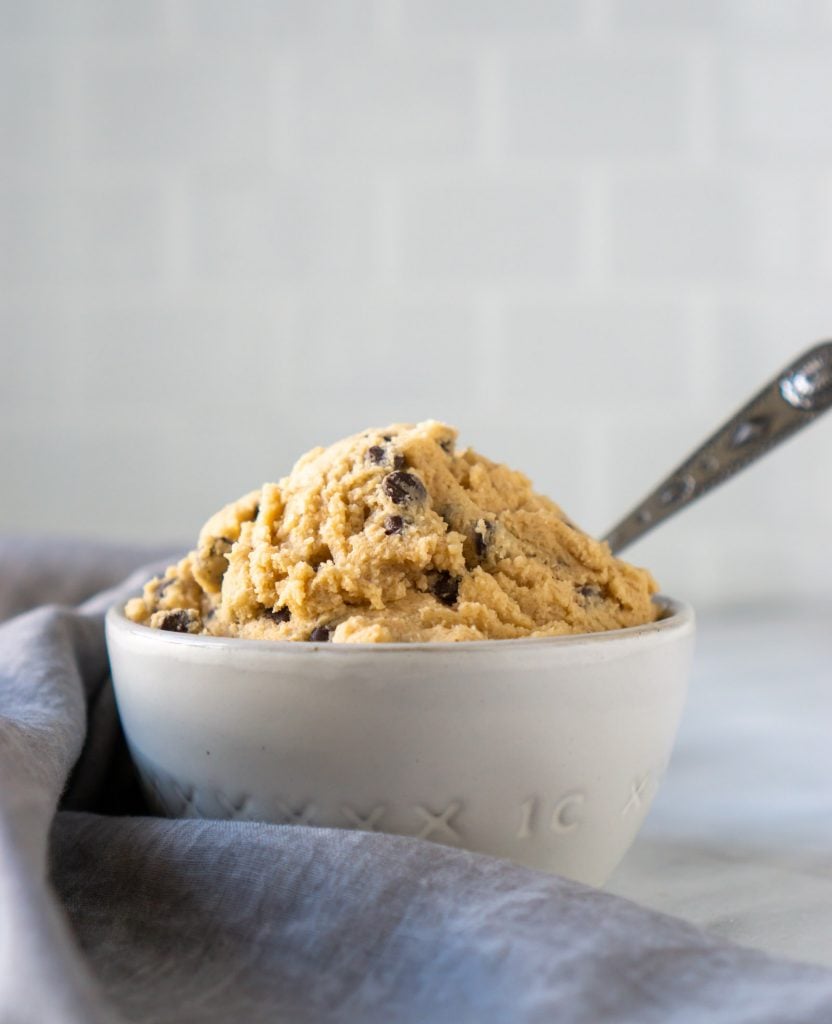 edible cookie dough in a small grey bowl with a spoon