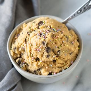 edible cookie dough in a small bowl with a spoon