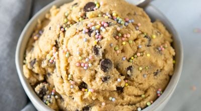 edible cookie dough in a small bowl with a spoon