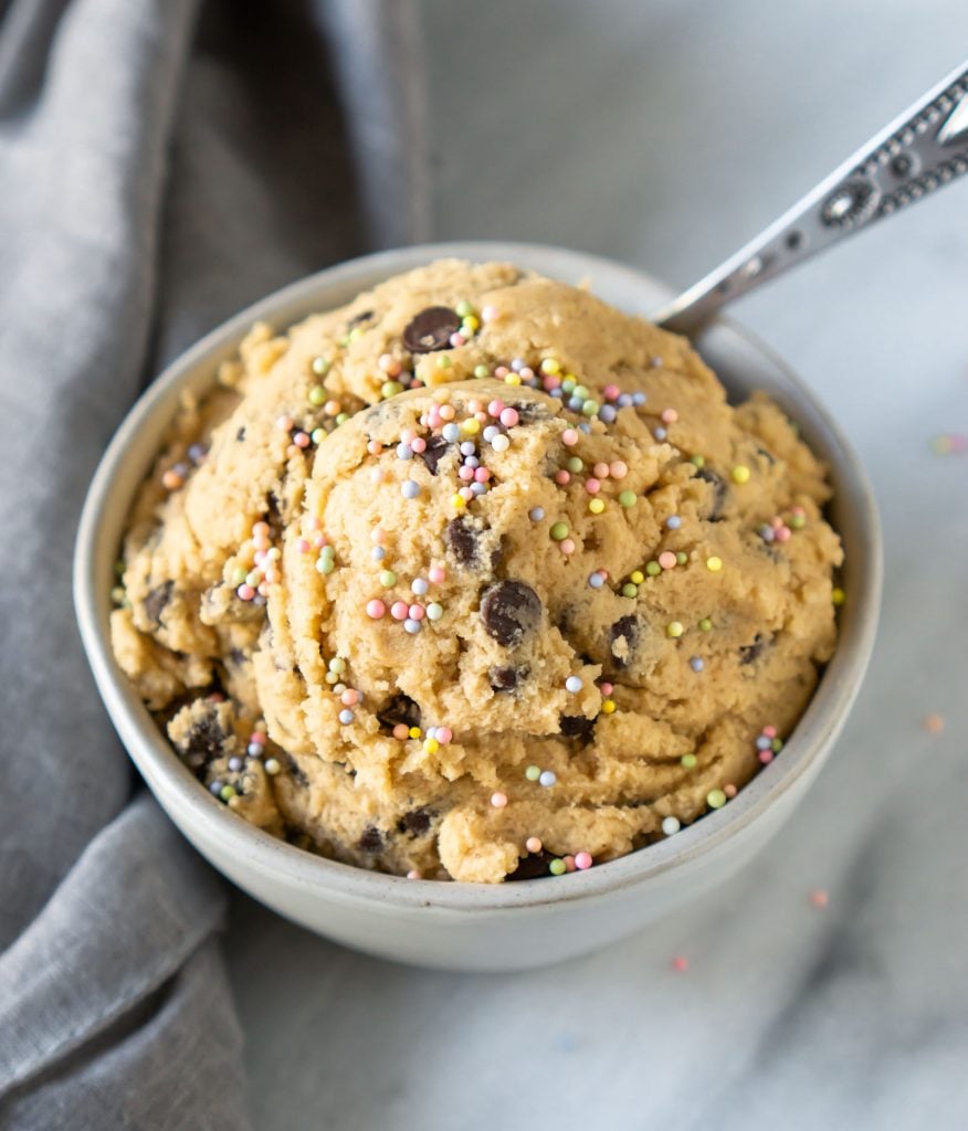 edible cookie dough in a small bowl with a spoon
