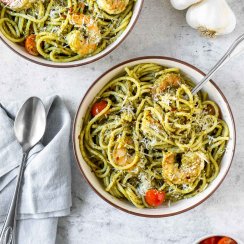 two bowls of basil pesto shrimp pasta