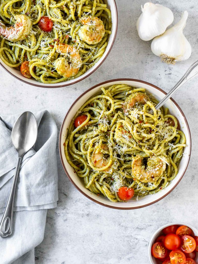 two bowls of basil pesto shrimp pasta