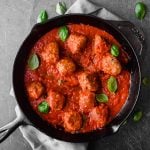 turkey meatballs in a cast iron pan with red sauce