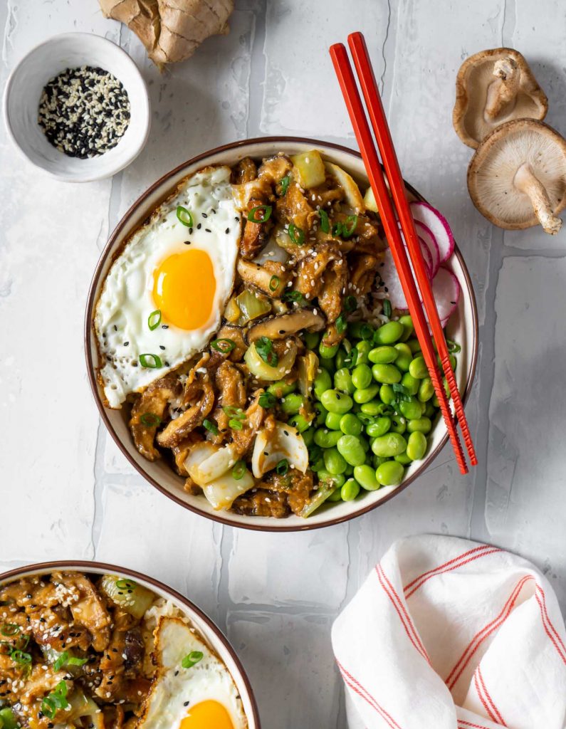 2 maple miso mushroom bowls with red chopsticks