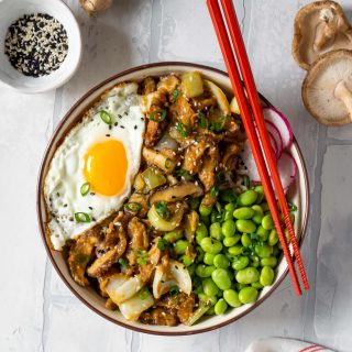 miso mushroom bowl with red chopsticks