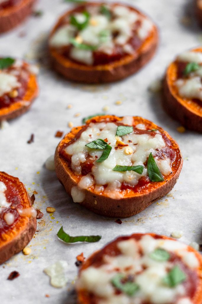 sweet potato pizzas on a baking sheeta