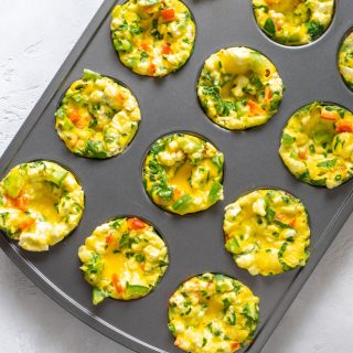 mini egg frittatas in a muffin tin