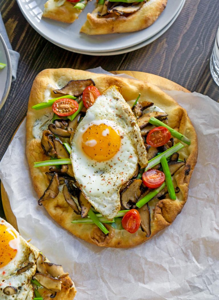 vegetable breakfast pizza on parchment paper