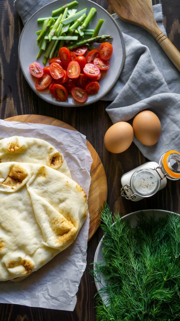 naan, eggs, tomatoes, dill, and asparagus