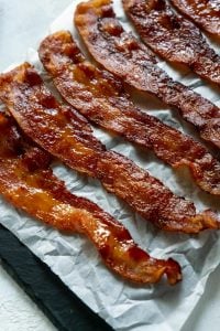 candied bacon on parchment paper
