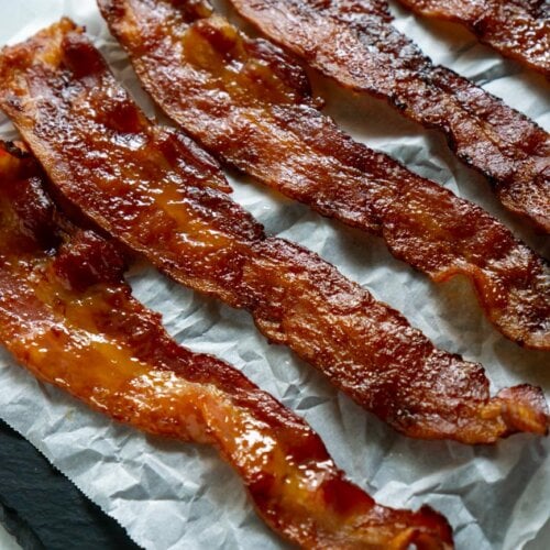 candied bacon on parchment paper