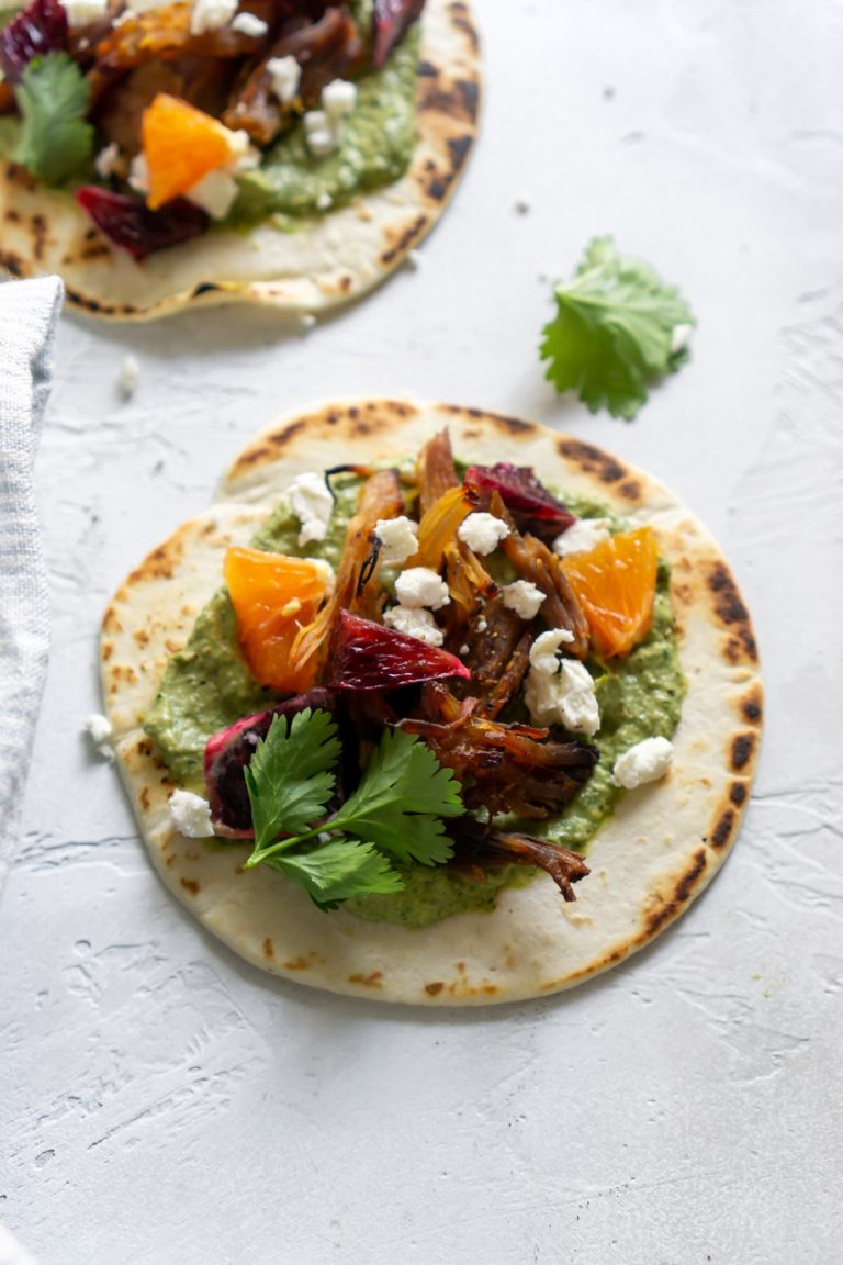 pork carnitas taco on a white background