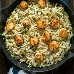 linguine with clam sauce and scallops in a pan